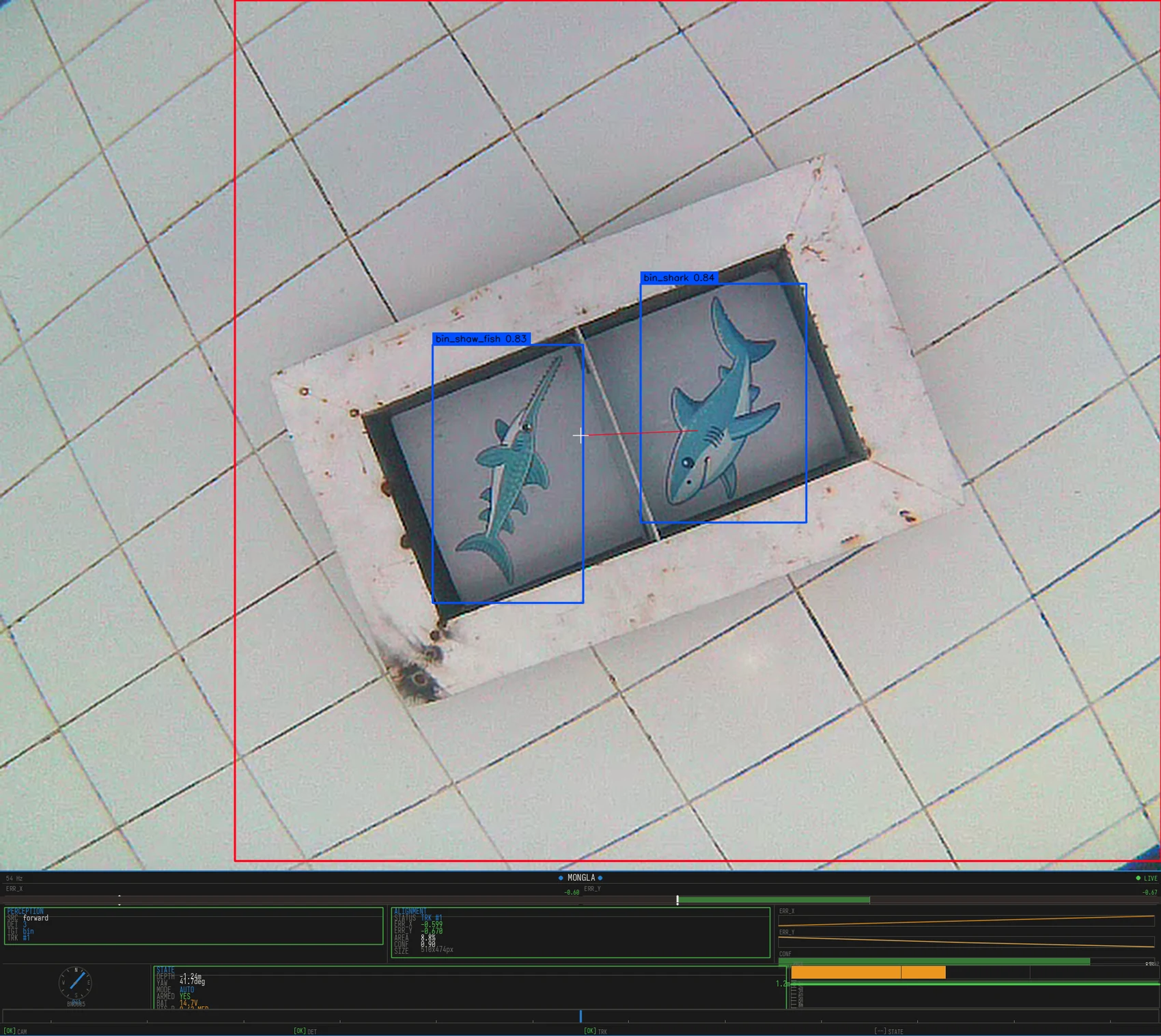 The competition bin tray with its sawfish and shark placards, both read by the real detector